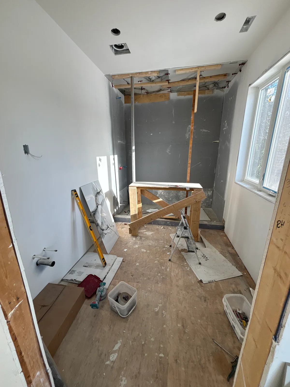 Bathroom Renovation with Sculptural Bathtub — during construction