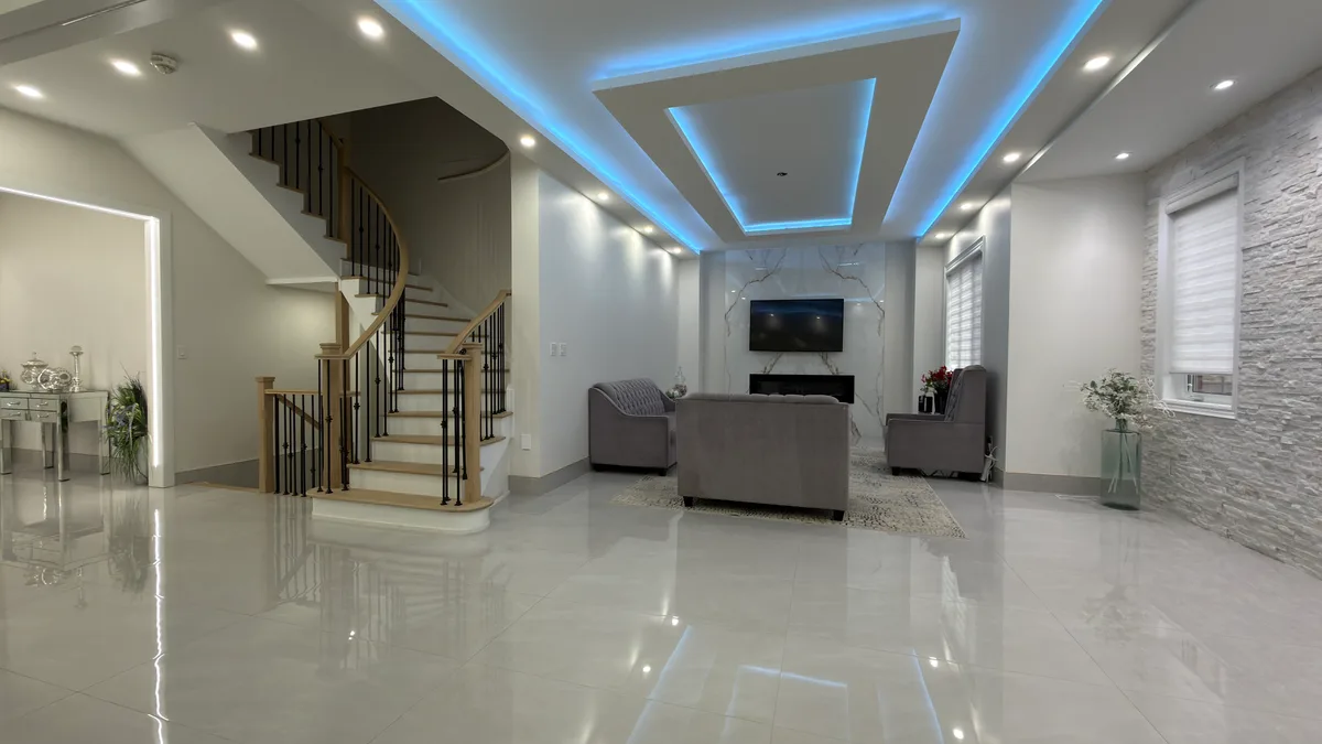 A coordinated main-floor renovation connects the living area, dining room, hallway and staircase