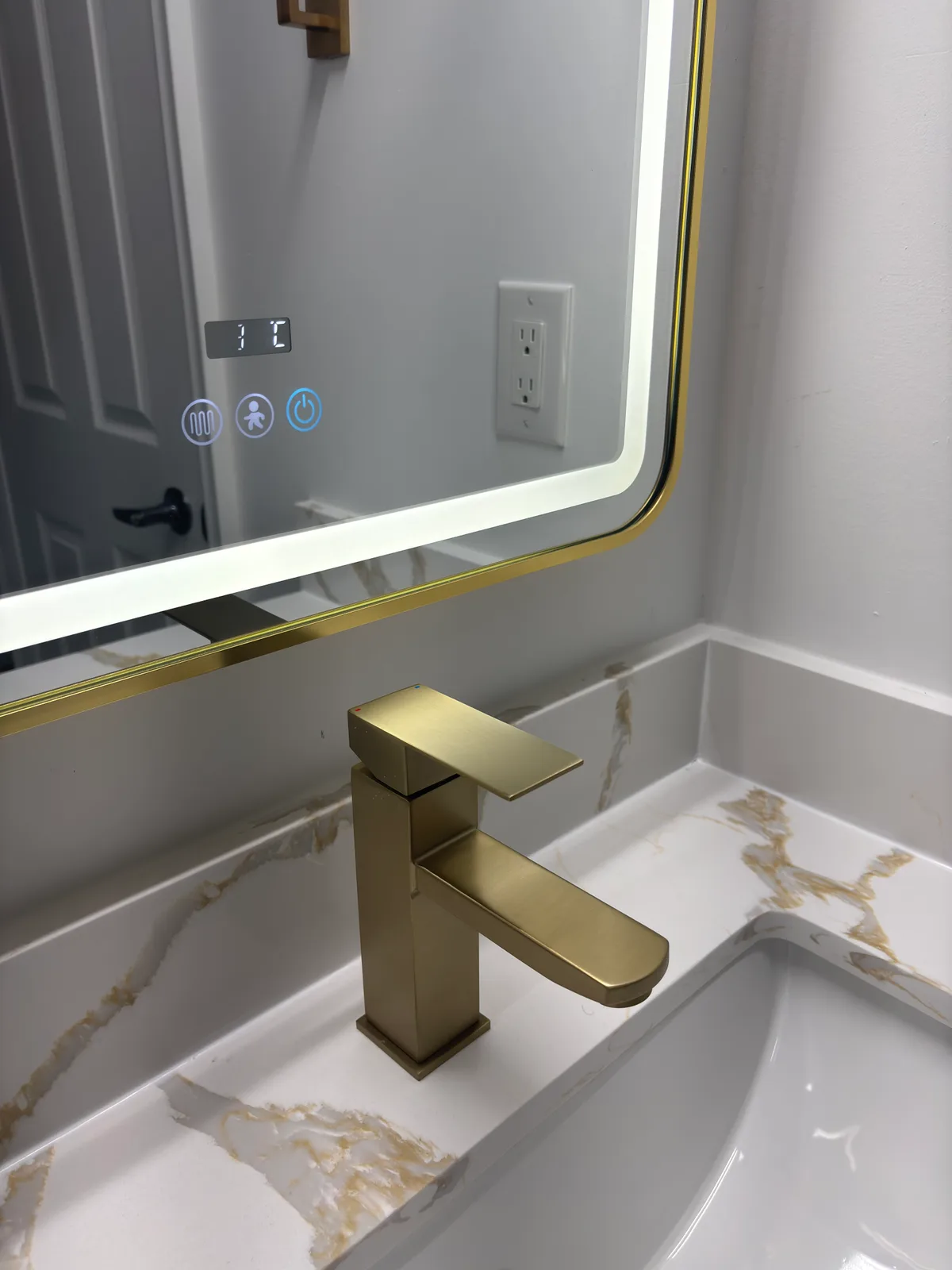 Compact Bathroom Renovation with Gold Accents: finished detail 2