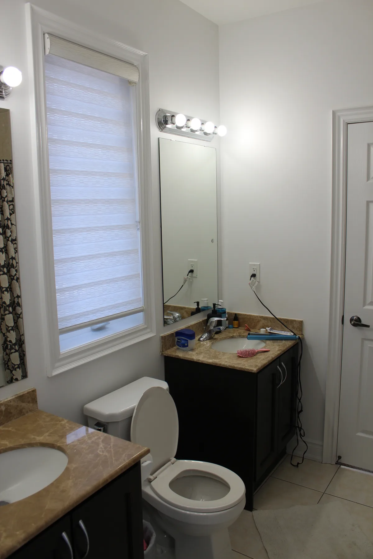 Compact Bathroom Renovation with Gold Accents — during renovation